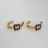 Gold Stud Earrings with Black Enamel Accent