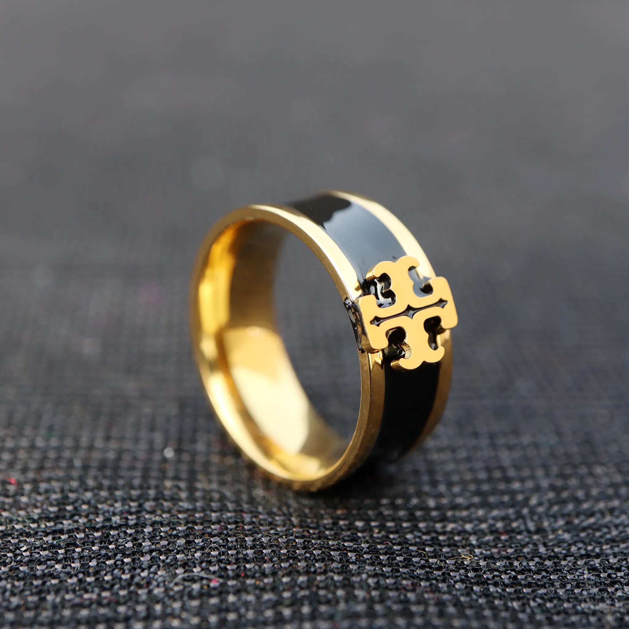 Gold-Plated Black Enamel Ring with Decorative Emblem