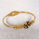Tory Burch floral Gold Bangle for sale