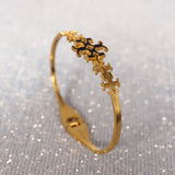 Tory Burch floral Gold Bangle in budget