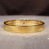 channel gold bangle