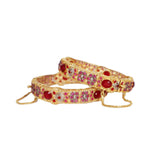 gold bangles with pink stones