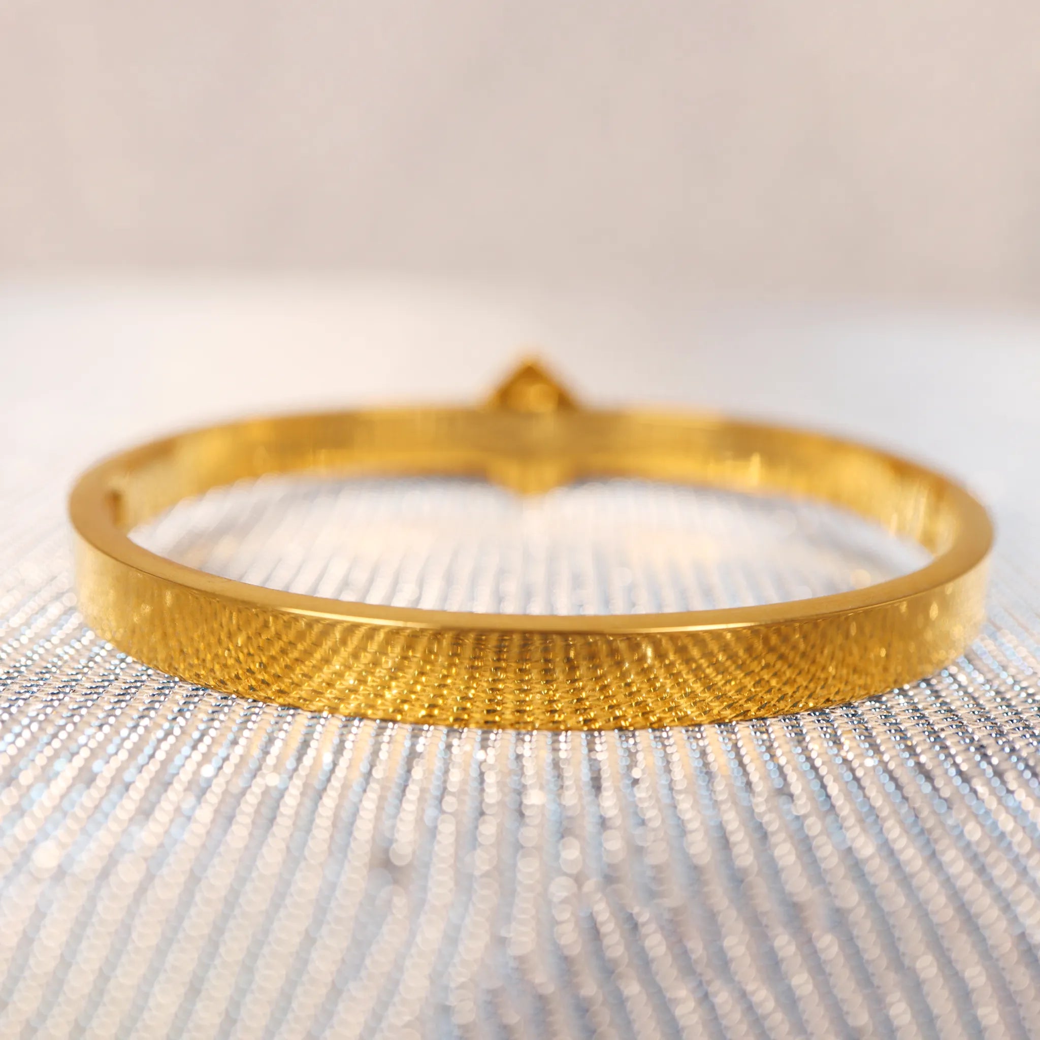 versache gold bracelets