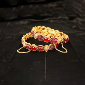 golden bangles with red stones